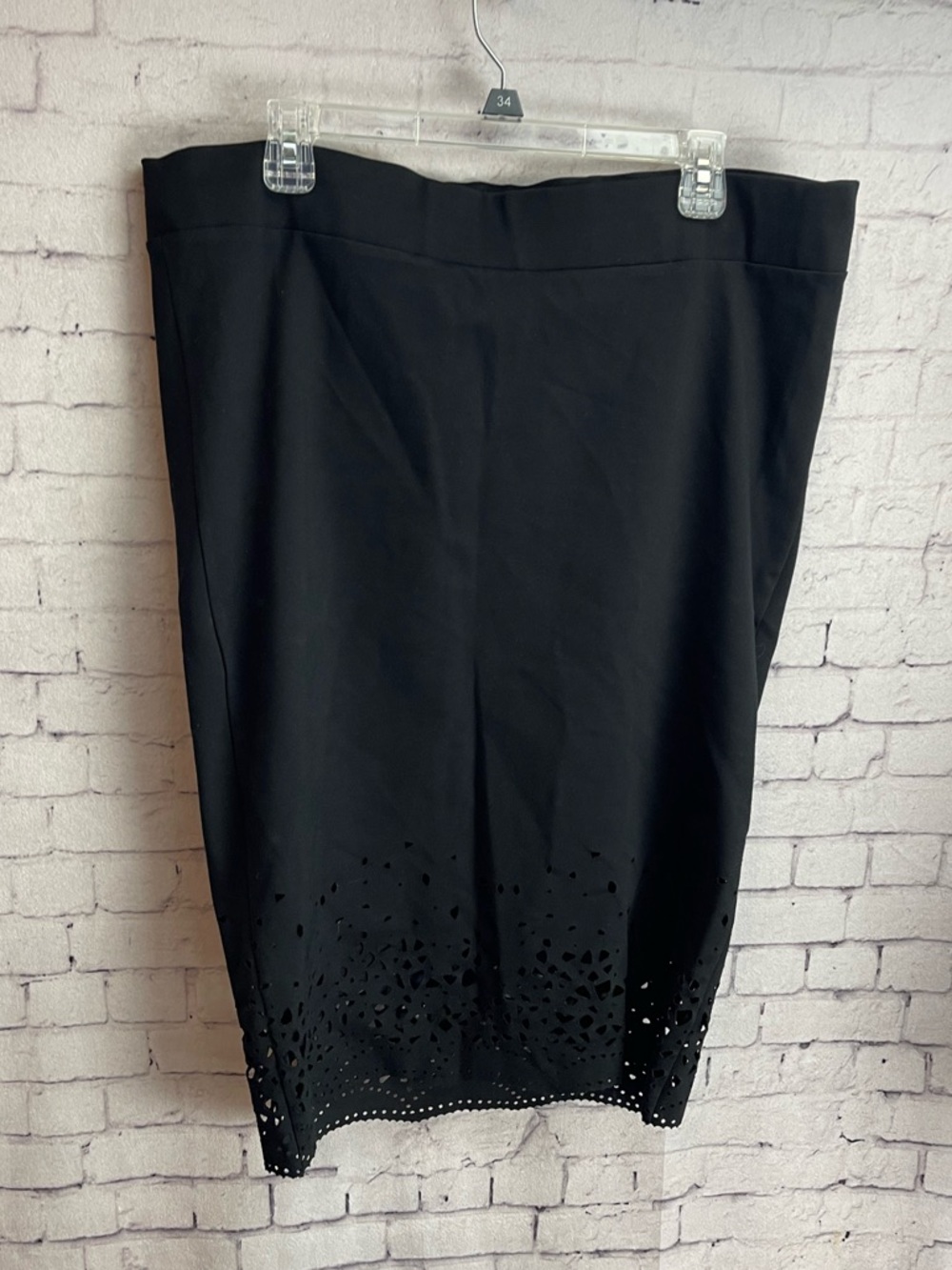 Torrid black pencil skirt with laser cut lace pattern at hem